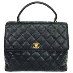 Vintage Chanel top handle flap front black caviar leather handbag