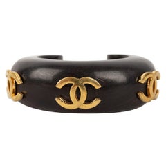 Vintage Chanel Wooden Bracelet Decorated with Gilded Metal CC Logos