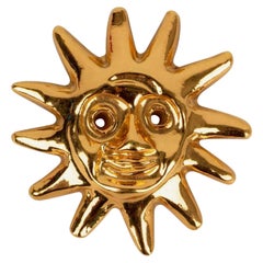 Christian Lacroix Sonnenbrosche aus vergoldetem Metall