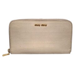 Used Miu Miu Light Beige Embossed Leather Zippy Long Continental Wallet