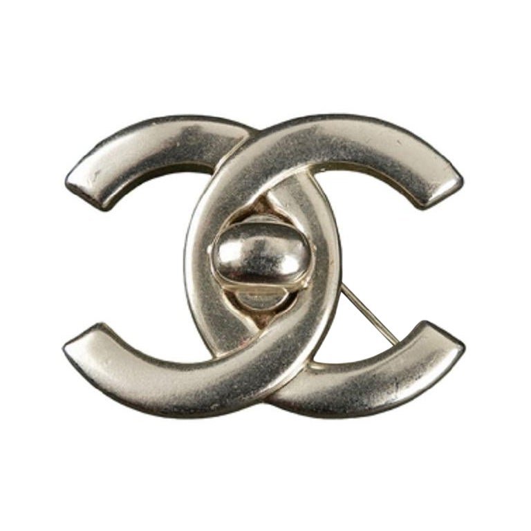 Chanel Turnlock Silver Plated Metal Brooch, 1996 For Sale at 1stDibs