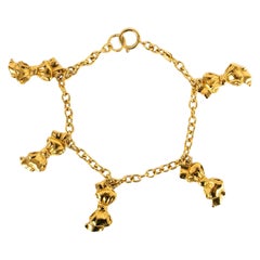 Chanel Collier court en métal plaqué or avec breloques