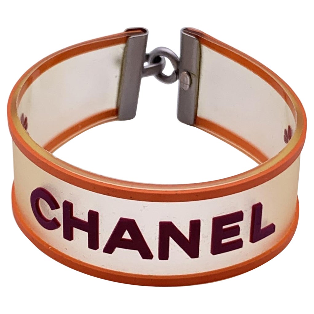 Chanel Clear Purple Orange Rubber Logo Quatrefoil Bracelet at 1stDibs