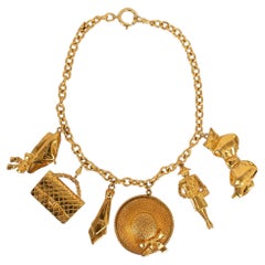 Chanel Charm Necklace in Gold Metal
