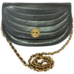 Vintage Chanel black lambskin half moon 2.55 chain shoulder bag with golden CC.
