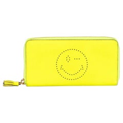 Anya Hindmarch Gelbes kontinentales Portemonnaie für Damen aus Kalbsleder mit Smiley-Reißverschluss
