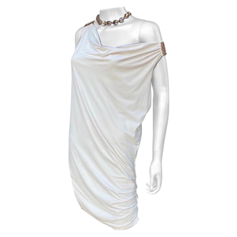 Is it a chic chemise dress? Is it a swim cover-up? It’s both actually. The simple but so glam dress is from the swim division of American designer Carmen Marc Valvo. Looks great with a drape front cowl neck or pull it off to one shoulder. The