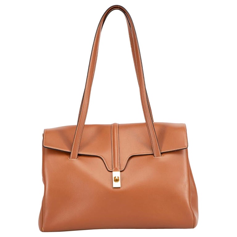 New! Celine bag. Clutch on strap in triomphe canvas and smooth calfskin.  Color tan, pop orange. 