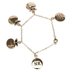 Nina Ricci Bracelet à breloques pommes en or pour femmes