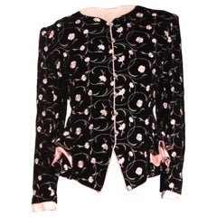 Used Ungaro black velvet evening jacket  with pink embroidered flowers . c.1980s