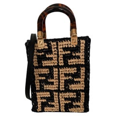 Fendi Monogrammierte schwarze/beige Raffia Mini-Sonnen-Tragetasche