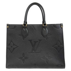 Louis Vuitton - On the go MM Empreinte Noir Cuir Top Handle Bandoulière