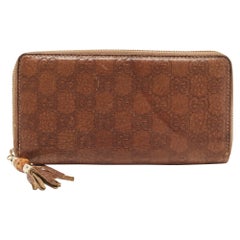 Gucci Brown Guccissima Leather Bamboo Tassel Zip Around Wallet (Portefeuille zippé en cuir de bambou)