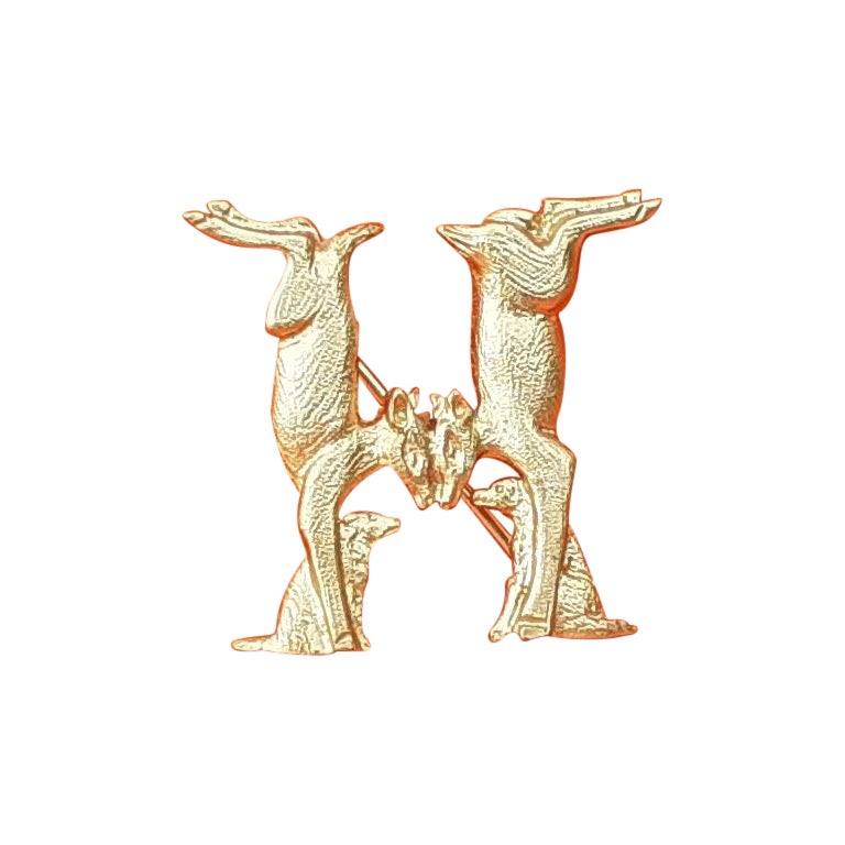Hermès Does and Dogs Forming an H Brooch in Golden Metal  For Sale