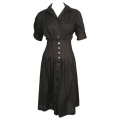 Robe noire Jean-Paul Gaultier des années 1990 avec taille corset