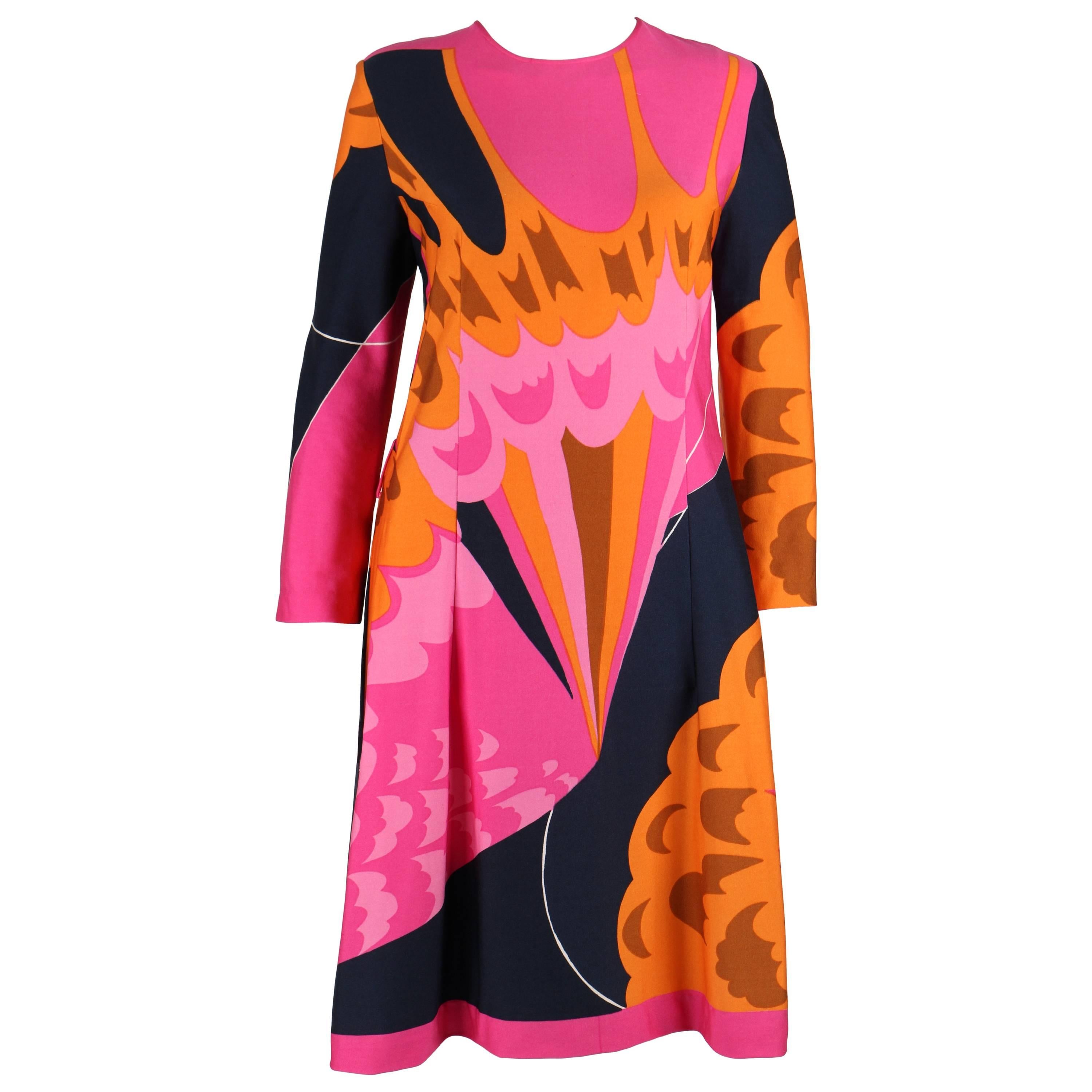 Vintage c.1970s Hanae Mori pink, orange, and navy multicolor abstract print shift dress. Long sleeve. Round neckline. Above the knee length. Two belt loops.  No Belt. Center back zipper closure. Unmarked Fabric Content: Poly-blend. Unmarked size: