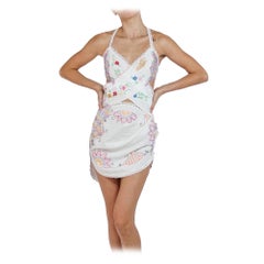 MORPHEW COLLECTION Weißes & mehrfarbiges Minikleid aus Baumwolle, Leinen und gehäkelter Spitze mit Häkelspitze