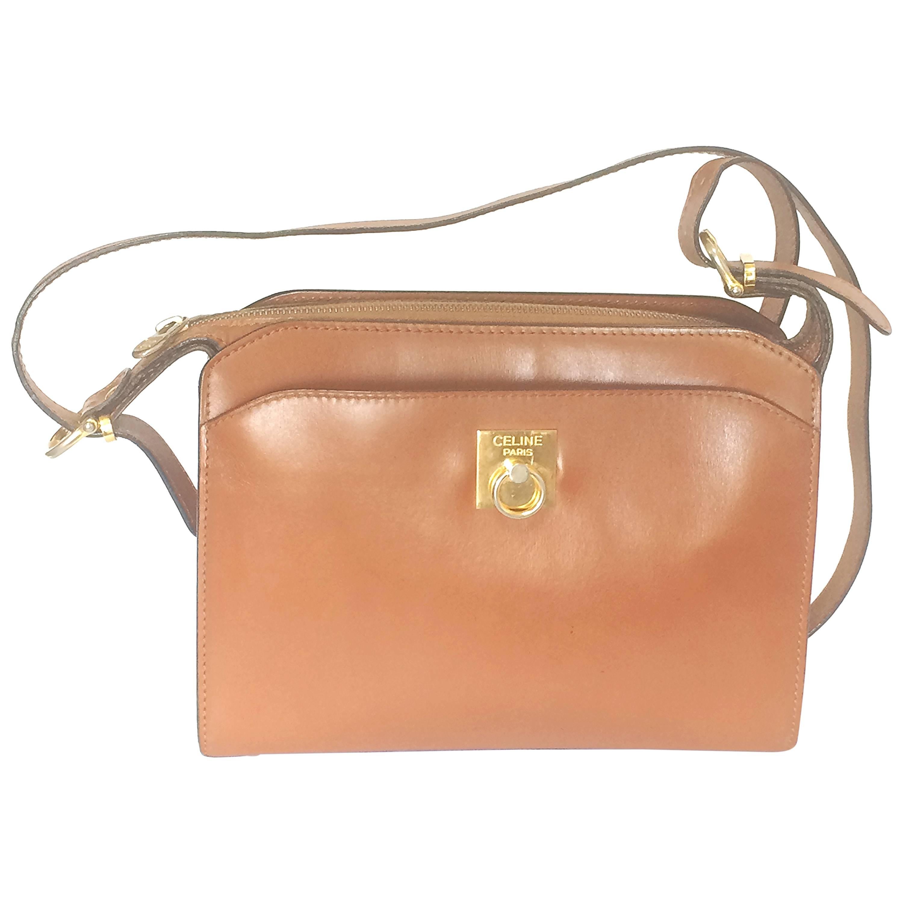 Vintage CELINE genuine brown leather shoulder bag with golden logo motif.