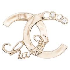Chanel Broche dorado rue Cambon
