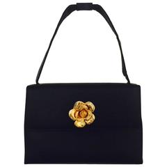 Retro 1990s Chanel Black Silk Satin Evening Flap Hand Bag With Gold Tone Camellia  