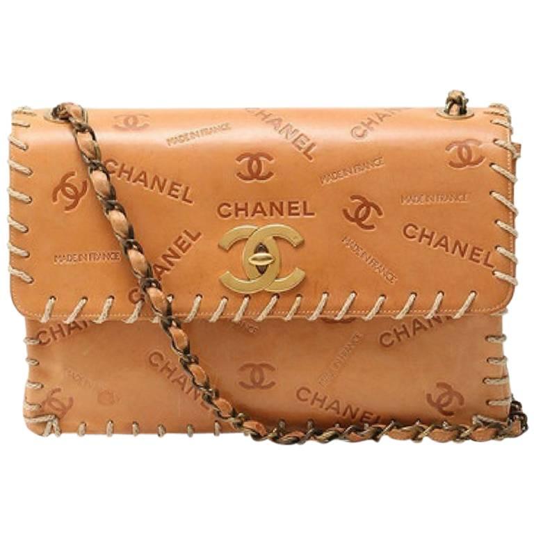 Vintage CHANEL tan brown allover logo embossed leather jumbo, large
