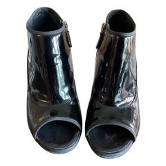 Chanel patent leather open toe ankle boots.