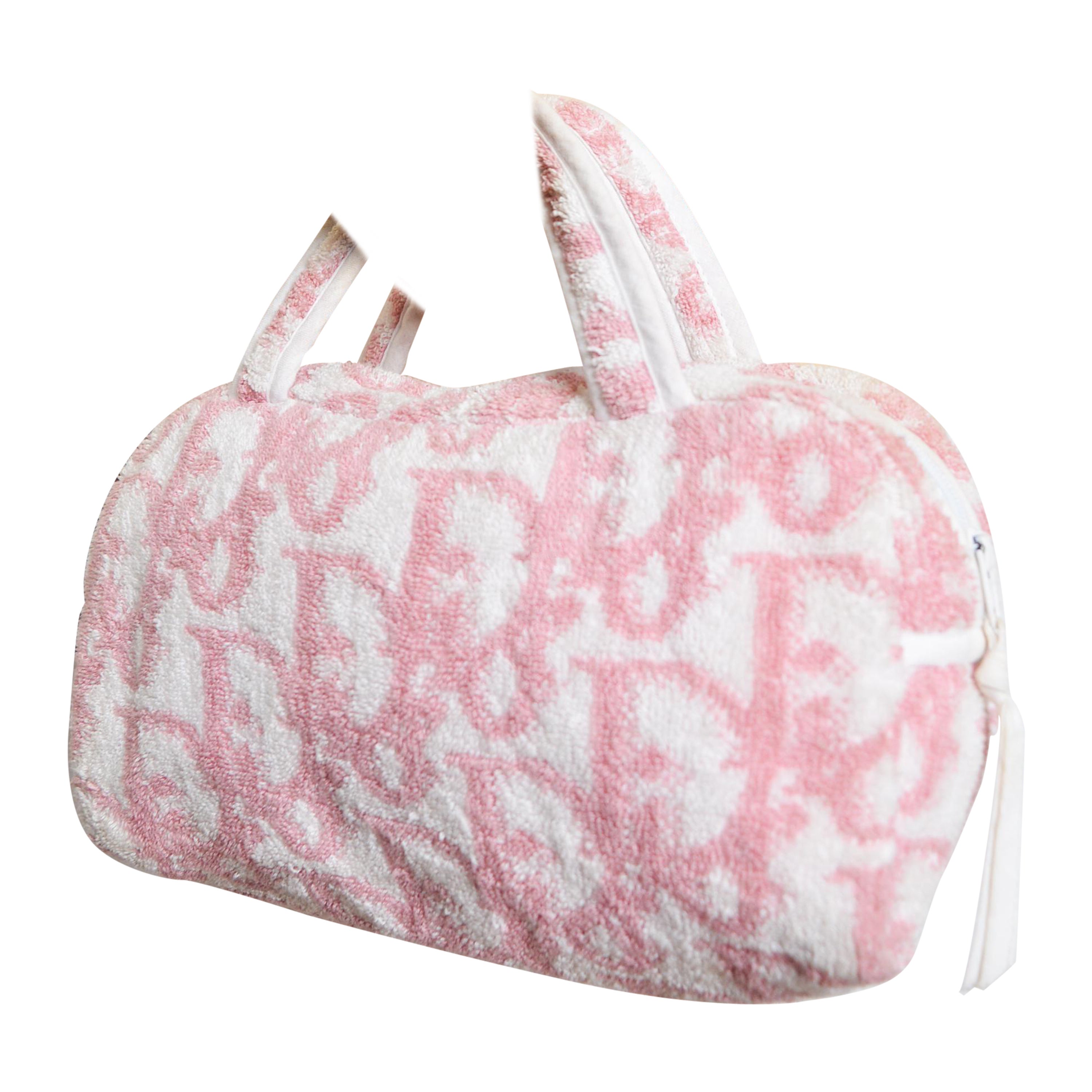A Vintage Christian Dior Mini bag (circa 2000), by John Galliano constructed from a Pink and white trotter print terry cloth material.  

MADE IN FRANCE.  

Features ; Two handles, Zip fasten closure, Wipeable Plastic interior lining, 2 slip pockets