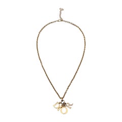 Christian Dior Gold Metall-Halskette mit baumelnden Buchstaben und Logo
