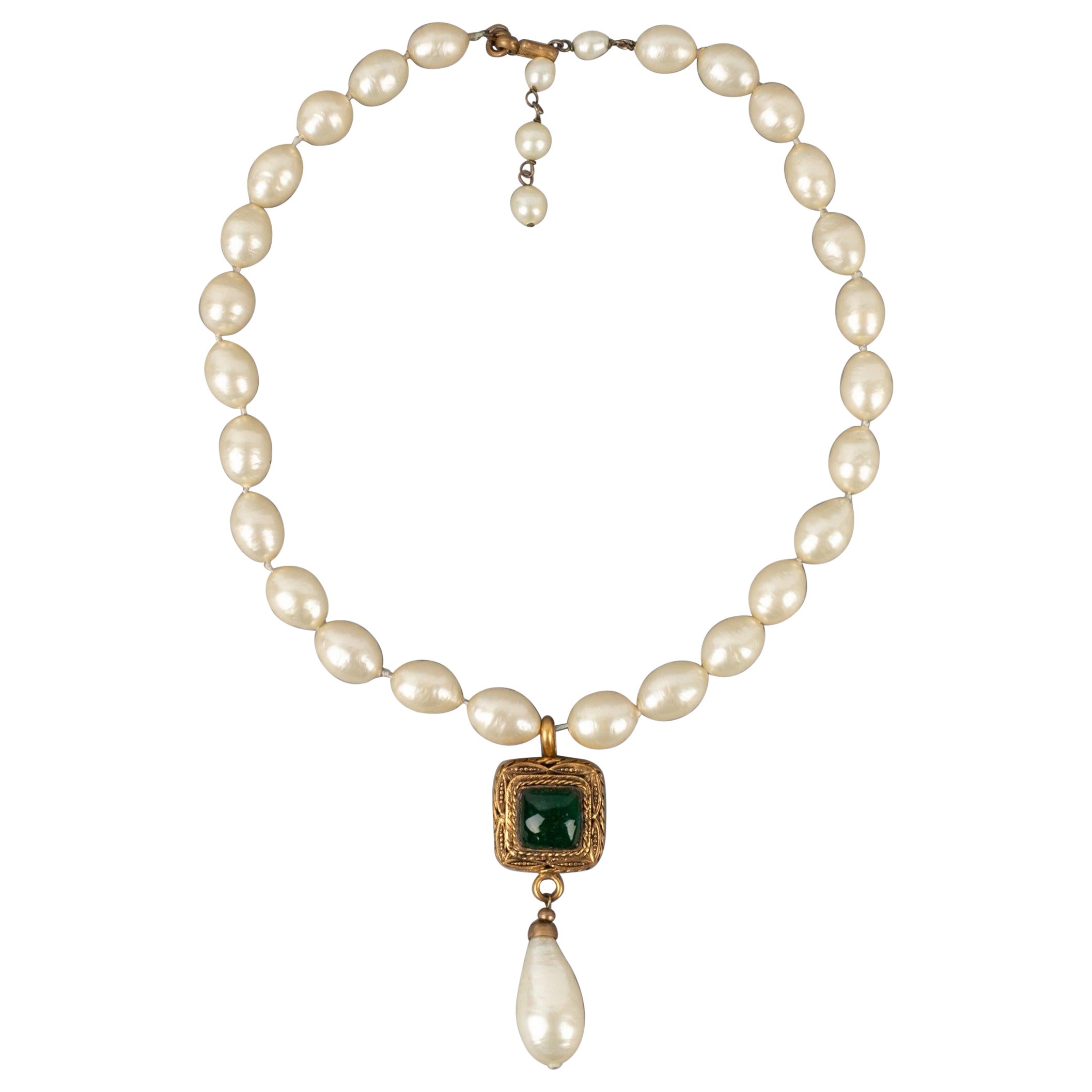 Chanel Costume Pearl Necklace with a Golden Metal Pendant, 1983 For Sale