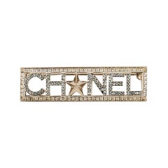 Chanel Champagner Metallbrosche aus durchbrochenem Metall, verziert mit Strasssteinen, 2018