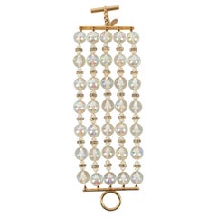 Chanel Bracelet en métal doré avec cercles de strass et perles transparentes