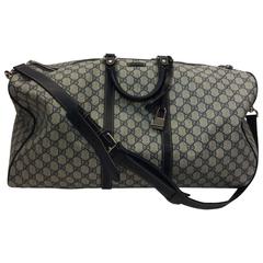 Gucci Large Leather Trimmed Signature GG Printed Canvas Duffle bag