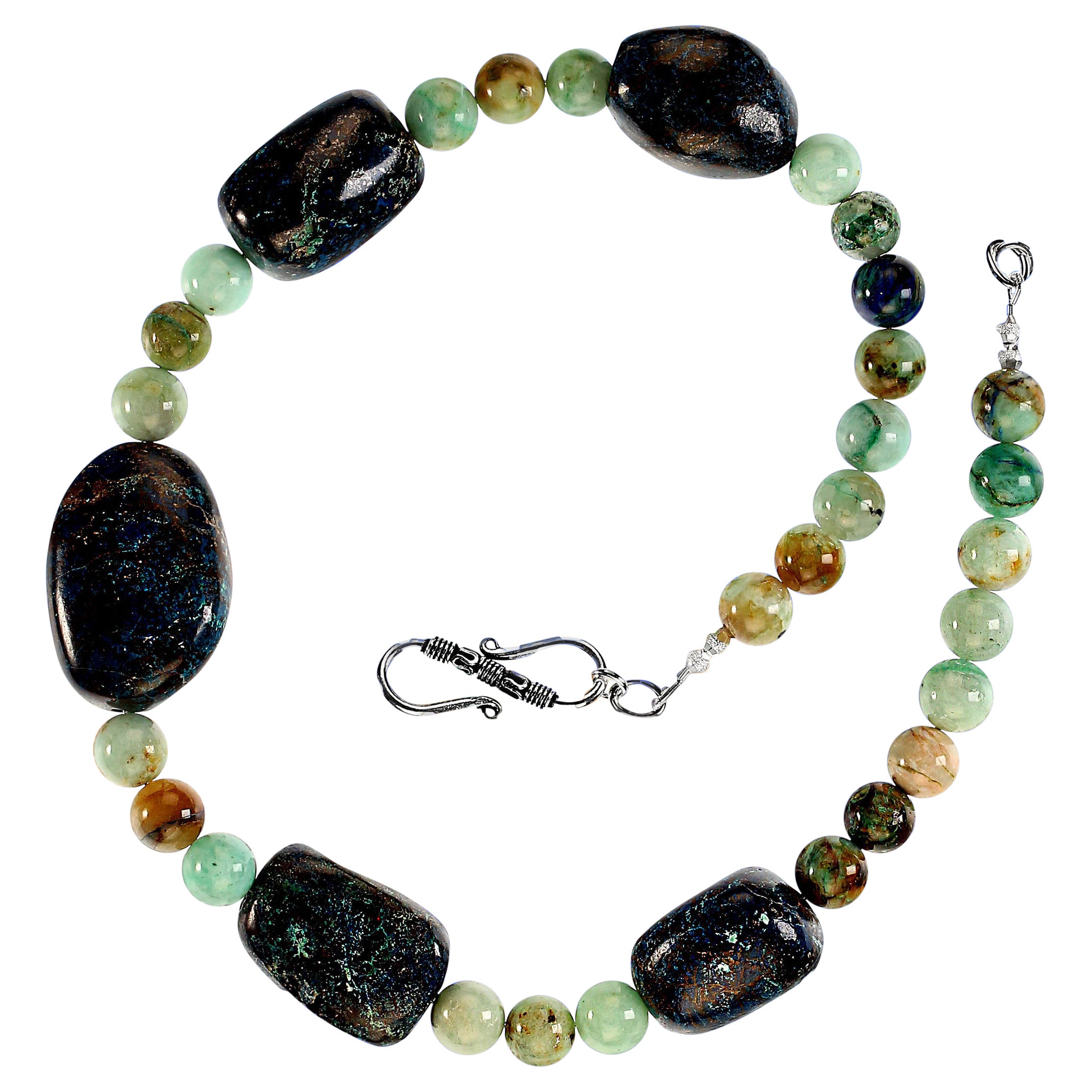 Unique 19-inch chrysocolla necklace featuring two very different looks of chrysocolla.  These lovely green 10mm beads are smooth and highly polished. They exhibit various shades of green as well as brown, blue, and tan.  The five large focals