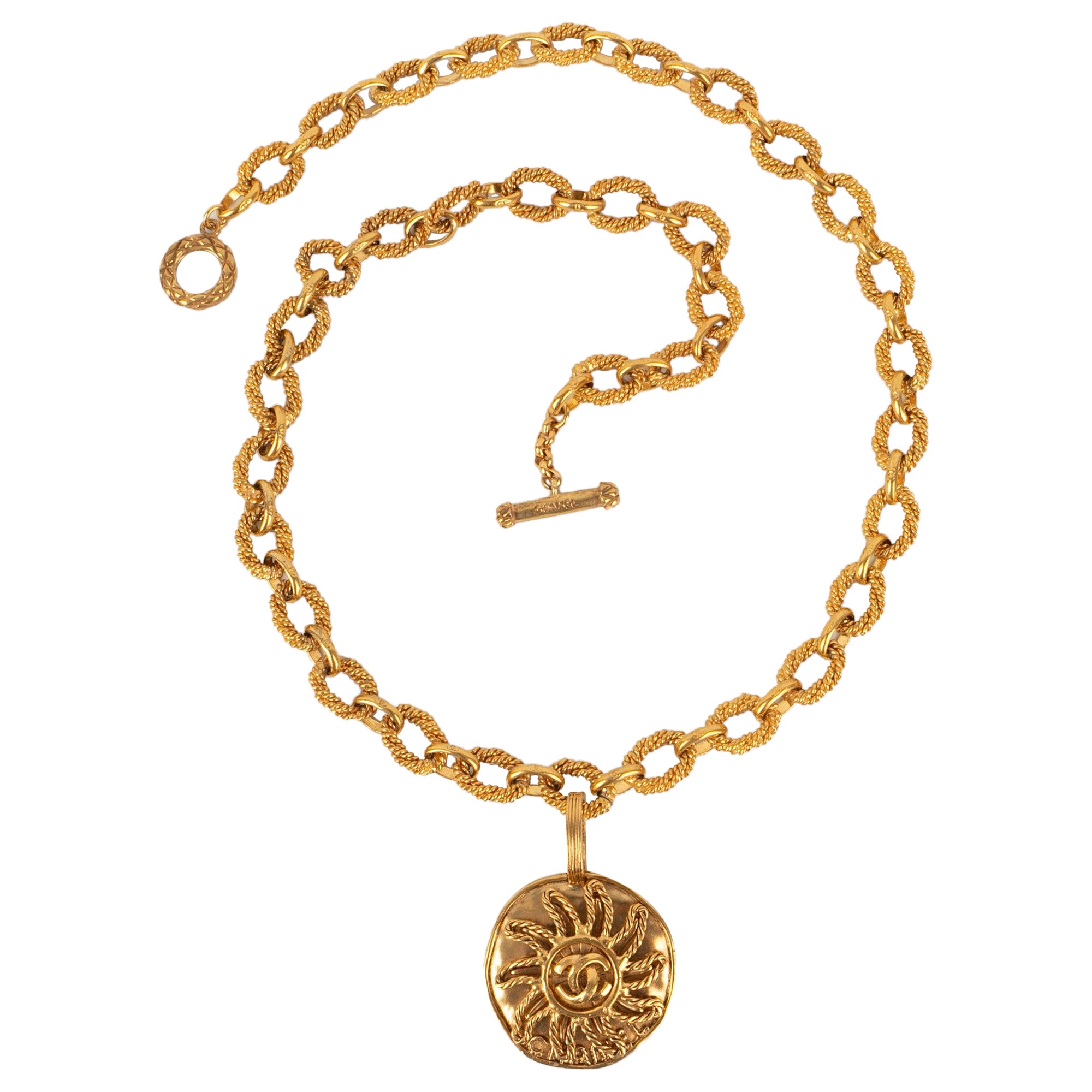 Chanel Golden Metal Necklace with a Sun Pendant, 1993 For Sale