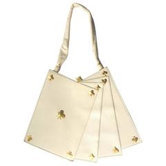 Anne-Marie of Paris white leather and gilt 'Hand of Cards' handbag. 1