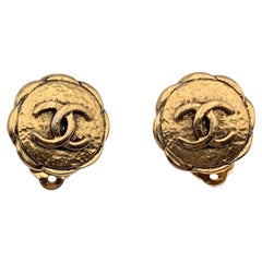 Chanel Vintage Gold Metal Embossed CC Logo Flower Clip On Earrings