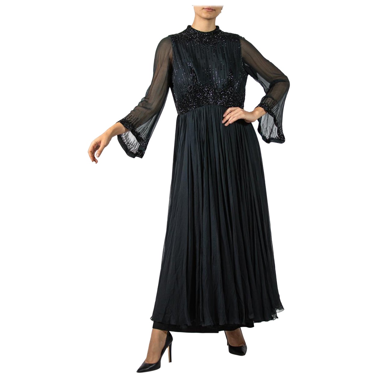 1960S Black Beaded Silk Chiffon Demi-Empire Waist Gown With Bell Sleeves For Sale