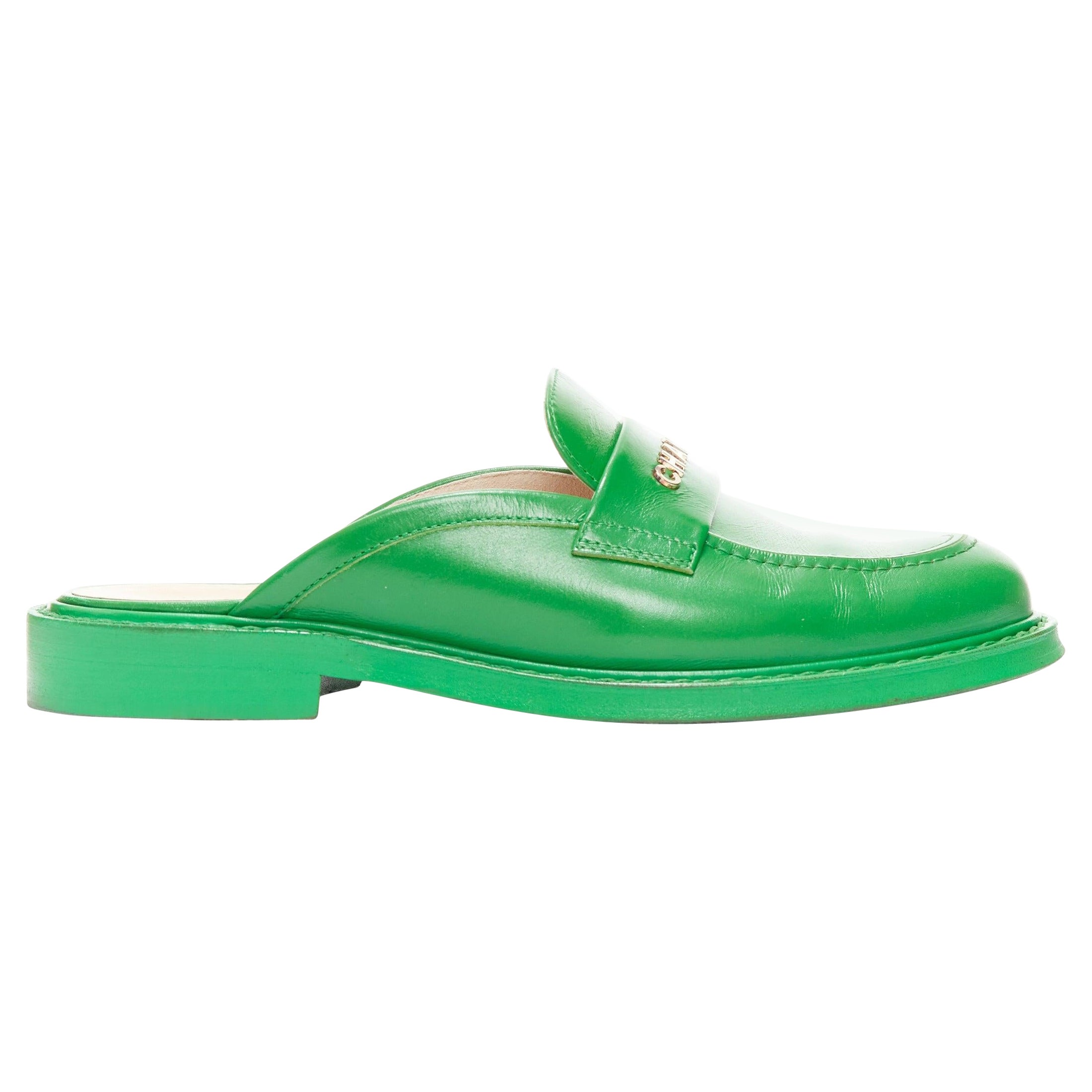 rare CHANEL PHARRELL green leather logo embellished slip on loafer flats EU37.5 For Sale