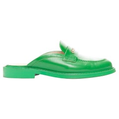 rare CHANEL PHARRELL green leather logo embellished slip on loafer flats EU37.5