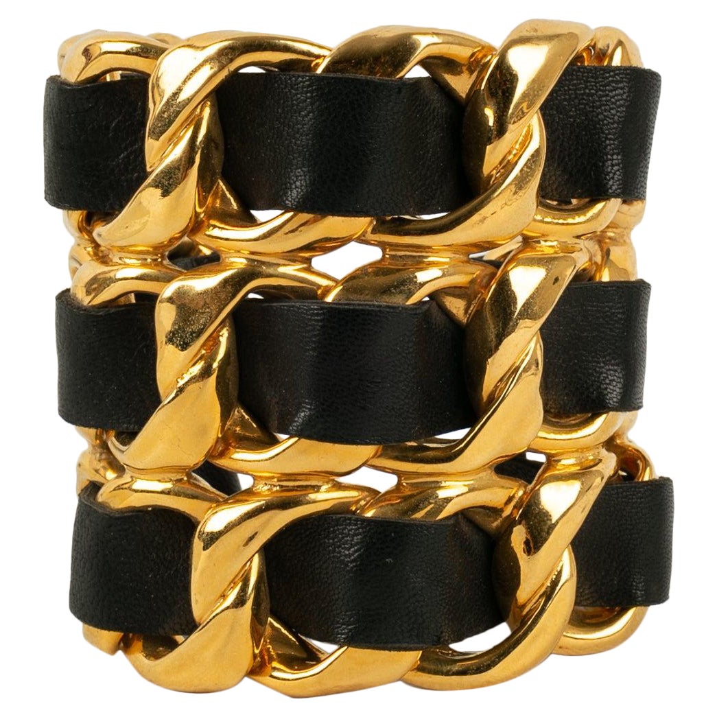 Chanel Cuff Bracelet in Golden Metal and Black Leather For Sale