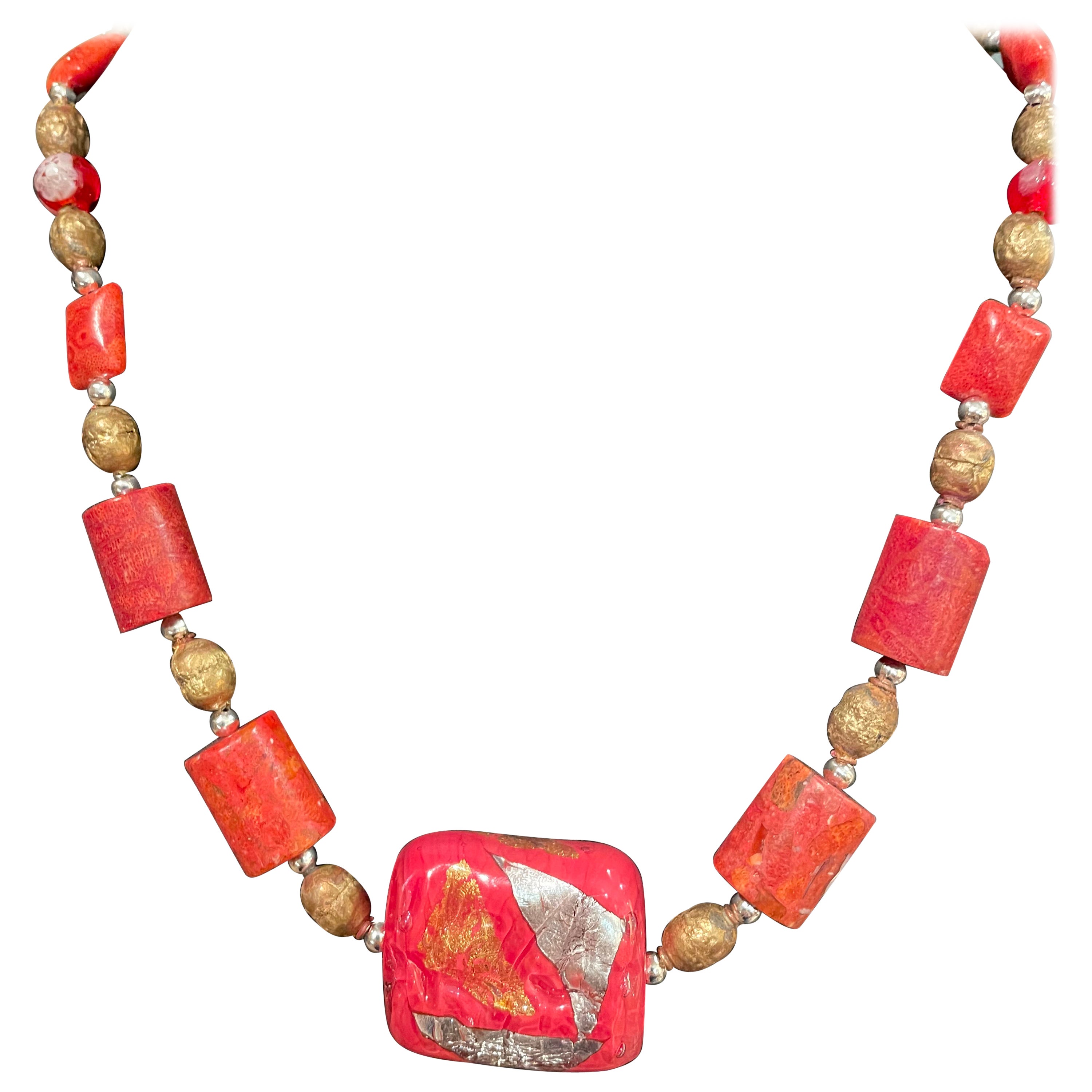 LB offers a handmade, one of a kind, Venetian bead and coral necklace with brass