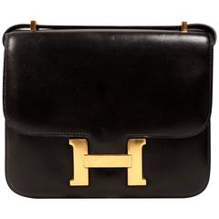 Vintage HERMES Constance 'mini' black leather with gold hardware 18cm