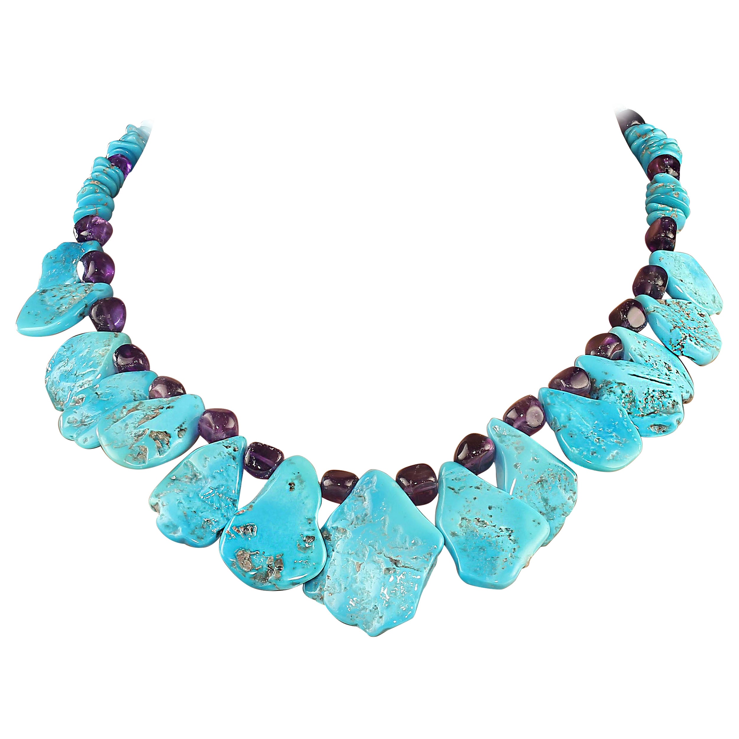 18-inch unique Sleeping Beauty turquoise tablets accented with amethyst necklace.  This one-of-a-kind necklace features graduated flat Sleeping Beauty turquoise tablets, 38x29- 21x17mm accented with nuggets of glowing translucent 8mm amethyst.  The