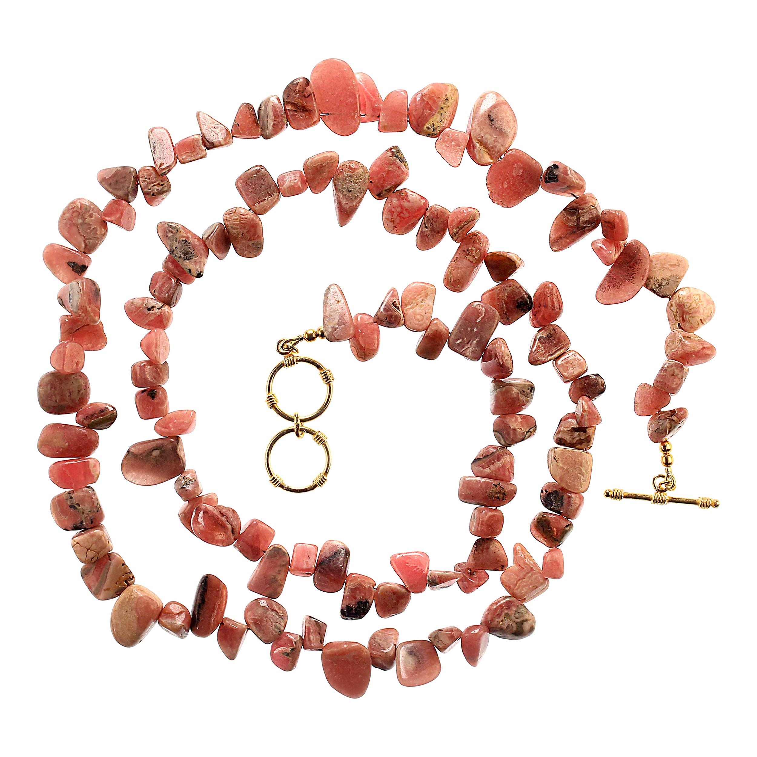 31-inch necklace of rhodochrosite highly polished nuggets.  These gorgeous nuggets vary in size from 5x5mm to 17x7mm.  They show lovely color and striations in color.  At 31 inches the necklace can often be wrapped twice.  It is secured with a goldy