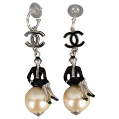 Chanel Silvery Metal Earrings "Coco on the World", 2004