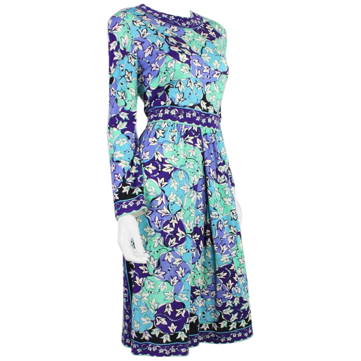 Vintage dress from Pucci dates to the 1970's and is made of floral printed cashmere blend.  Long sleeves with round neck. Center front inverted pleat in the skirt.  Unlined.  Center back zipper.

Labeled vintage size 14; please refer to