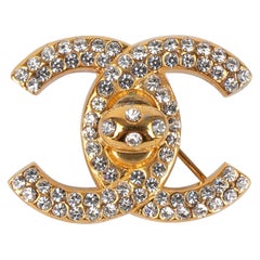 Chanel Golden Metal Turnlock Brooch Ornamented With Swarovski Rhinestones, 1996