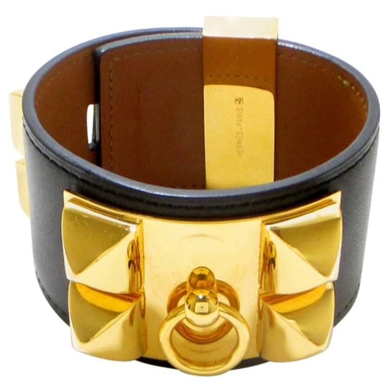 2012 Hermes Collier De Chien Dark grey, black and golden bangle bracelet.