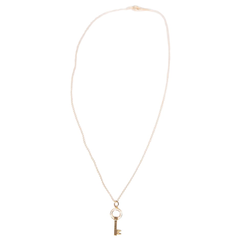 Tiffany & Co. Diamond 18K Gold Modern Open Round Key Pendant Necklace For Sale