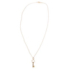 Tiffany & Co. Diamond 18K Gold Modern Open Round Key Pendant Necklace